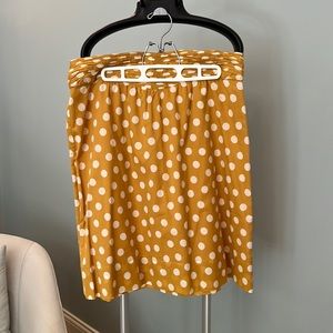 Pretty Tory Burch skirt in mustard yellow with cream polka dots